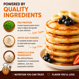 Stack of pancakes with fruit and syrup on a plate, featuring protein ingredients and text about quality ingredients.