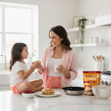 Mom and daughter enjoying vanilla protein pancakes made with Nut Dreamers pancake and waffle mix — healthy family breakfast